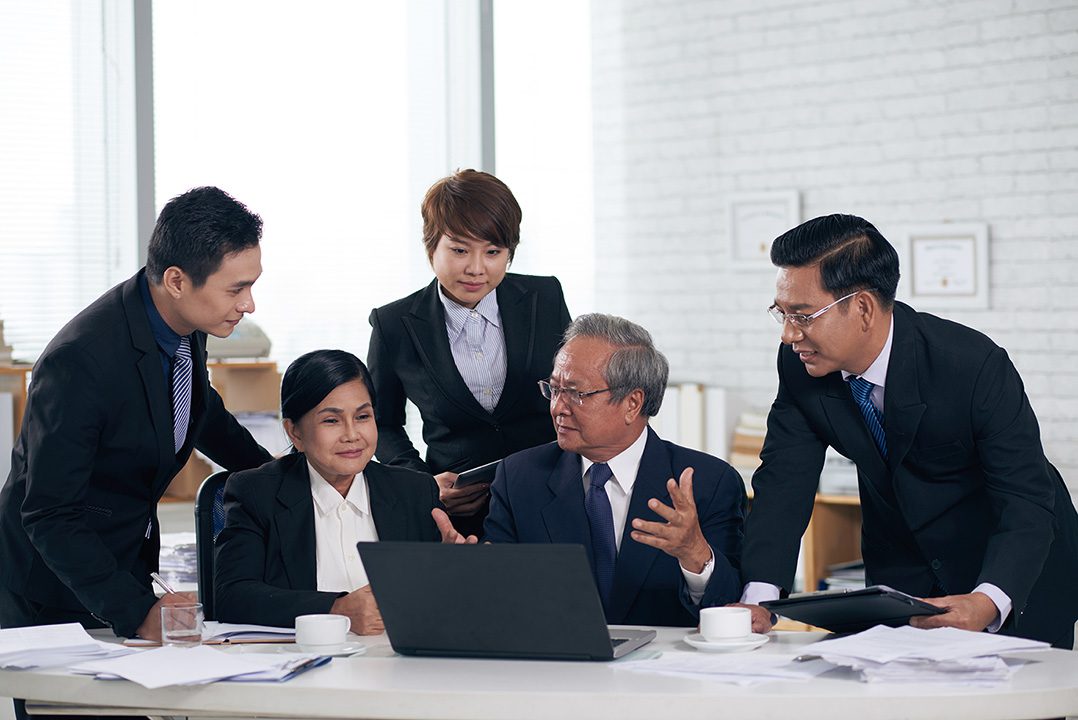 AdobeStock_202421994-B Asian Attorneys at a conference